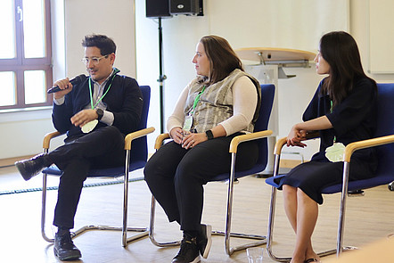 3 alumni at a panel discussion